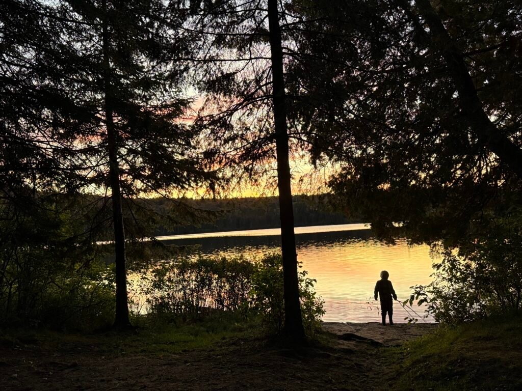 family camping sunset lake